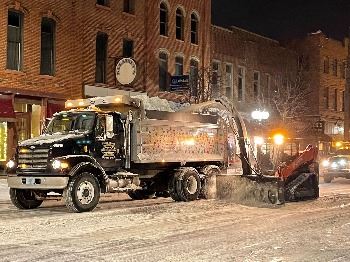 Snow Blower Dumping Snow Into Dump Truck